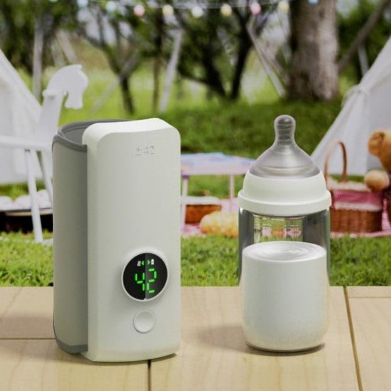 Portable Baby Bottle Warmer – USB rechargeable milk heating bag next to a baby bottle outdoors.