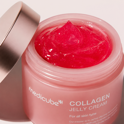 Open Collagen Jelly Cream jar showing glossy pink jelly texture and rose-gold lid.